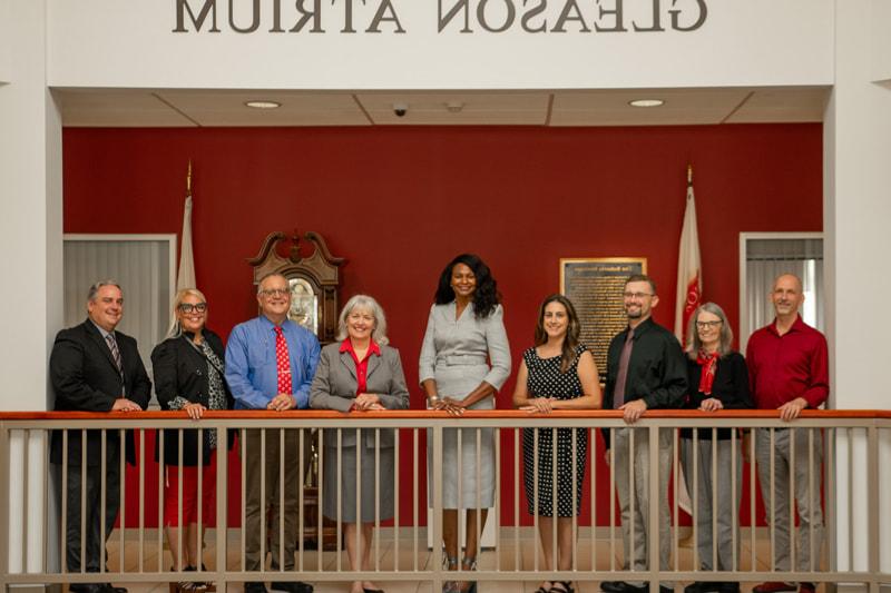 A photo of campus overlayed in red with "Academic Leadership" text on it.